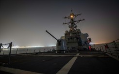 The US guided-missile destroyer USS Carney shot down more than a dozen drones in the Red Sea launched from Huthi-controlled areas of Yemen, defense officials say