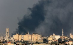 Smoke billows over Khan Yunis in the southern Gaza Strip during Israeli bombardment 