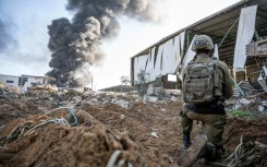 Smoke rises over Khan Yunis in the southern Gaza Strip during Israeli bombardment on December 20, 2023