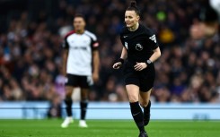 Landmark achievement: Rebecca Welch takes charge of the match between Fulham and Burnley as she becomes the first female referee of an English Premier League football fixture 