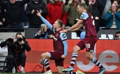 West Ham's Jarrod Bowen (L) celebrates scoring against Manchester United