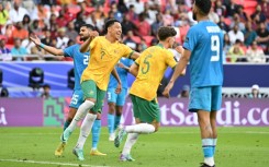 Jordan Bos celebrates after scoring Australia's second against India