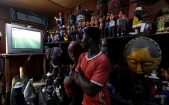 Secretary of State Antony Blinken is set to watch an Africa Cup of Nations match in Abidjan, where a vendor is seen watching on television on January 16, 2024