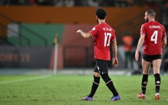 Egypt's Mohamed Salah walks off after picking up an injury against Ghana