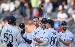 Tom Hartley (C) claimed seven wickets in India's second innings to help England to victory in the first Test in Hyderabad