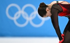 Under pressure: Russia's Kamila Valieva fell from first to fourth after the free skating final at the Beijing Olympics