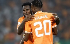 Franck Kessie (L) celebrates scoring for Ivory Coast with Christian Kouame.
