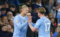 Erling Haaland (left) is ready to start after a two-month injury layoff, says Pep Guardiola