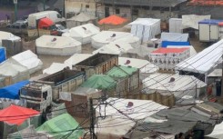 Makeshift tents flooded by heavy rain in Rafah