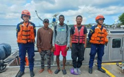 This photo released by the Colombian navy on 
February 2, 2024 shows sailors posing with three Panamanians who survived 11 days adrift in the Pacific Ocean