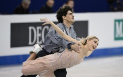 Sailing across the ice in billowing steel grey and baby pink, Gilles and Poirier wowed the crowd with their complex choreography 