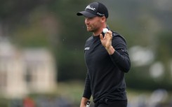 Wyndham Clark of the United States acknowledges the crowd after making the course record low score of 60 at the Pebble Beach Pro-Am on Saturday.