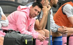 Lionel Messi sits on the bench during the friendly football between a Hong Kong XI and Inter Miami