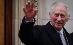 Britain's King Charles III waves as he leaves the London Clinic, in London, on January 29, 2024