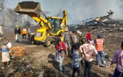 Flames reached high into the sky from the explosion at the fireworks factory, which destroyed entire buildings in a wide blast site