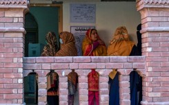 Women waiting to cast their ballot a polling station in Lahore