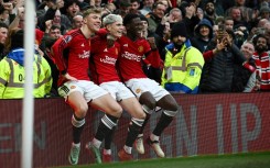 Manchester United's Alejandro Garnacho (C), Rasmus Hojlund (L) and Kobbie Mainoo (R)