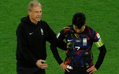 Jurgen Klinsmann and Son Heung-min after defeat in Qatar