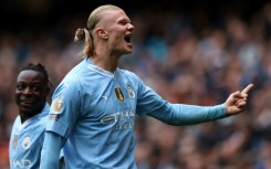 Manchester City striker Erling Haaland celebrates scoring against Everton