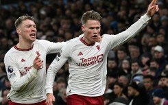 Manchester United's Scott McTominay (R) celebrates scoring the winner at Aston Villa