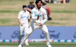 New Zealand's Rachin Ravindra celebrates the wicket of South Africa's Zubayr Hamza