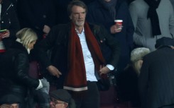 Manchester United's prospective investor Jim Ratcliffe (C)