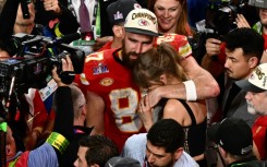 Taylor Swift and Kansas City Chiefs' tight end #87 Travis Kelce embrace after the Chiefs won Super Bowl LVIII against the San Francisco 49ers at Allegiant Stadium in Las Vegas, Nevada, in February 2024