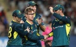 Australia's Adam Zampa celebrates the wicket of New Zealand’s Glenn Phillips