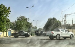 Chadian soldiers block the road leading to the headquarters of the opposition Socialist Party Without Borders' where  leader Yaya Dillo died during an army assault