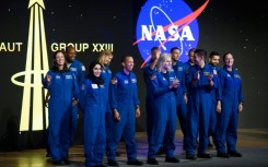 Astronaut graduates from the United States and United Arab Emirates during a ceremony at the NASA Johnson Space Center