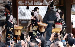 Kyoto's geisha, here celebrating a spring festival, perform traditional Japanese dance, music and games