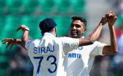 Off-spinner Ravichandran Ashwin (R) returned figures of 5-77 to help bowl out England for 195 inside three days at the picturesque Dharamsala stadium