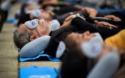 Around 200 people take part in a collective siesta in Mexico City to mark World Sleep Day