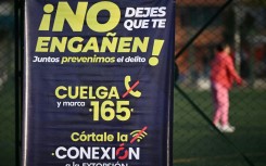 A poster in a crime-hit neighborhood of Bogota, urging people to report extortion attempts 