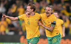 Australia's Kye Rowles celebrates scoring against Lebanon