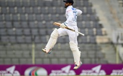 Sri Lanka's Dhananjaya de Silva celebrates after scoring a century during the third day of the first Test cricket match between Bangladesh and Sri Lanka