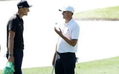 Poland's Adrian Meronk speaks with ninth-ranked Ludvig Aberg of Sweden during pracrice for the 88th Masters