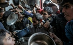 Palestinians jostled to obtain food aid in February in the northern Gaza Strip, where an estimated 70 percent of people face famine conditions