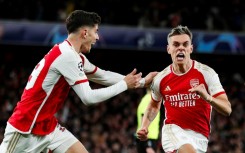 Arsenal's Leandro Trossard (R) celebrates after scoring against Bayern Munich