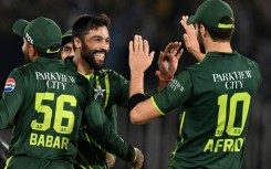 Back in business: Mohammad Amir (2L) celebrates after taking the wicket of New Zealand's Dean Foxcroft 