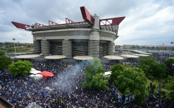 Inter Milan supporters celebrate their team's Serie A title outside the San Siro 