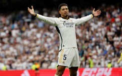 Real Madrid's English midfielder Jude Bellingham celebrates scoring against Cadiz as his team stormed towards the title