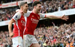 Arsenal's Leandro Trossard (L) and Declan Rice celebrate against Bournemouth