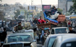 Displaced Palestinians flee Rafah for safer areas on May 7, 2024