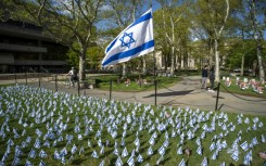 Israeli flags are pictured in front of a pro-Palestinian encampment (out of frame) on the lawn of the Stratton Student Center campus at the Massachusetts Institute of Technology (MIT) in Cambridge, Massachusetts, on May 9, 2024