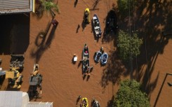 Historic levels of rainfall and flooding in southern Brazil, such as seen in this aerial view over Porto Alegre on May 6, 2024, have fueled a spate of conspiracy theories