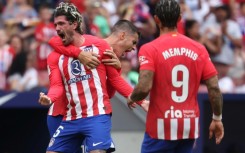 Atletico Madrid midfielder Rodrigo De Paul (L) celebrates his fine strike to earn his team victory against Celta Vigo