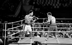 Muhammad Ali (L) reclaiming his world titles from George Foreman in Kinshasa, Zaire, in 1974