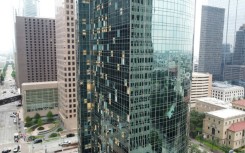 Shattered windows are seen on buildings in downtown Houston on May 17, 2024, one day after the city was hit by severe storms