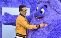 Actor and producer Ryan Reynolds hugs Blue as he arrives for the premiere of 'If' at the SVA Theater on May 13, 2024 in New York City